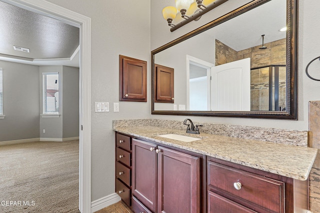 737 Colonial Blf, El Paso, TX 79928 - full bath with vanity, baseboards, and a tile shower