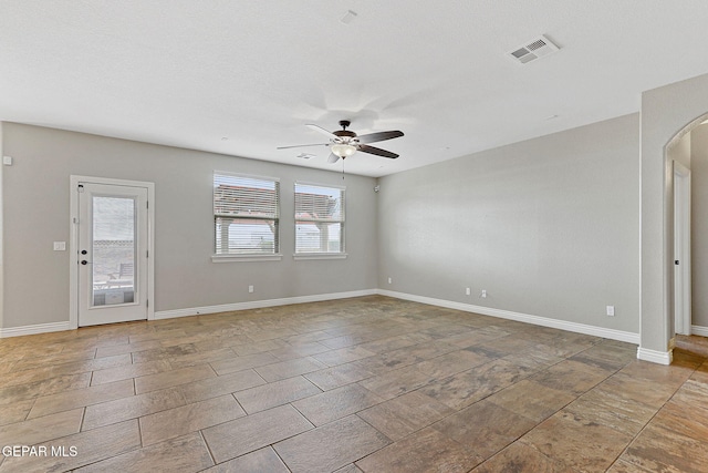 737 Colonial Blf, El Paso, TX 79928 - unfurnished room with ceiling fan, arched walkways, and baseboards