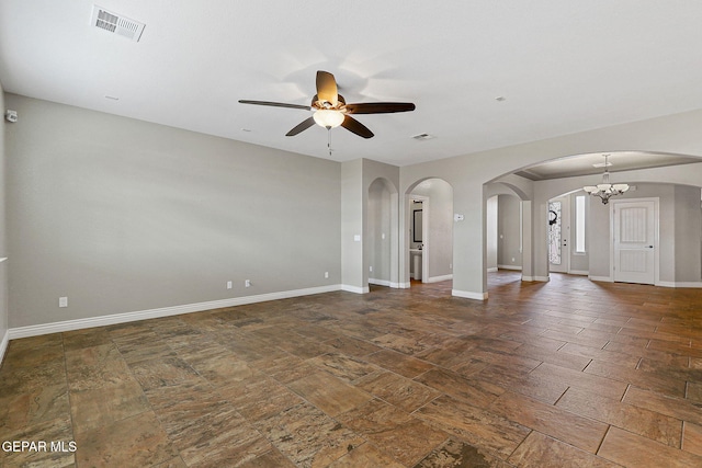 737 Colonial Blf, El Paso, TX 79928 - unfurnished room with arched walkways, ceiling fan, baseboards, and a chandelier
