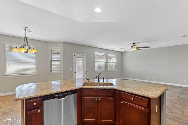 737 Colonial Blf, El Paso, TX 79928 - kitchen featuring stainless steel dishwasher, a sink, a ceiling fan, baseboards, and open floor plan