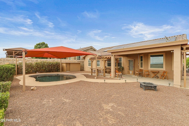 737 Colonial Blf, El Paso, TX 79928 - back of property featuring an outdoor fire pit, stucco siding, a patio, fence, and a swimming pool