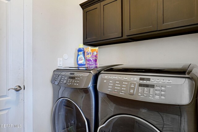 12748 Barstow Ave, El Paso, TX 79928 - clothes washing area with washing machine and clothes dryer and cabinet space