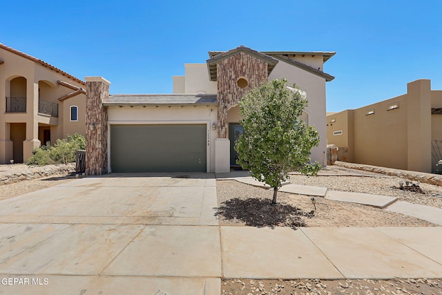 12748 Barstow Ave, El Paso, TX 79928 - view of front of property with stucco siding, a garage, and driveway