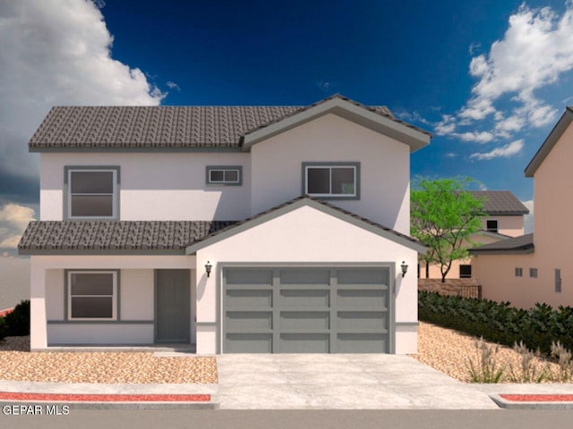 view of front of property featuring driveway, stucco siding, and a garage