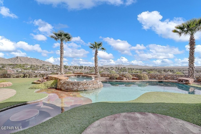 6664 Tuscany Ridge Dr, El Paso, TX 79912 - view of pool with a mountain view, a pool with connected hot tub, a yard, and a patio