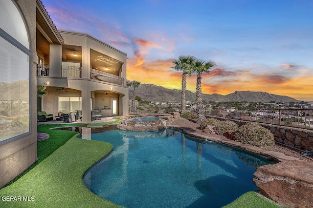 6664 Tuscany Ridge Dr, El Paso, TX 79912 - view of swimming pool featuring ceiling fan, a patio area, a mountain view, and a pool with connected hot tub