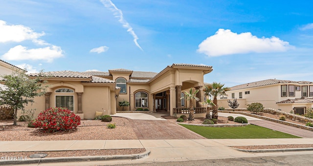 6664 Tuscany Ridge Dr, El Paso, TX 79912 - mediterranean / spanish house featuring stucco siding and a tile roof