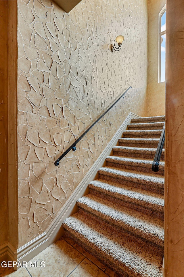 6664 Tuscany Ridge Dr, El Paso, TX 79912 - stairway featuring a textured wall and baseboards