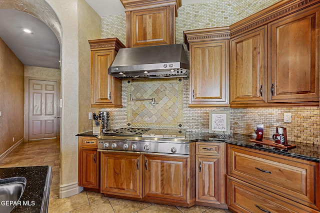 6664 Tuscany Ridge Dr, El Paso, TX 79912 - kitchen with extractor fan, stainless steel gas stovetop, and brown cabinets