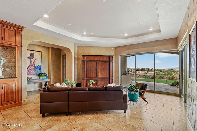 6664 Tuscany Ridge Dr, El Paso, TX 79912 - living room featuring arched walkways, a raised ceiling, light tile patterned floors, and recessed lighting