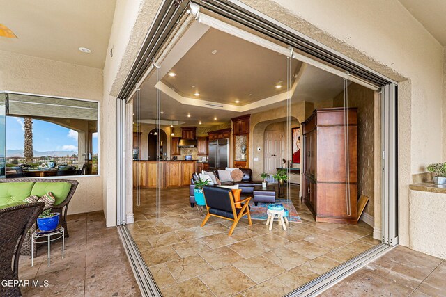 6664 Tuscany Ridge Dr, El Paso, TX 79912 - dining room featuring a textured wall and stone tile floors