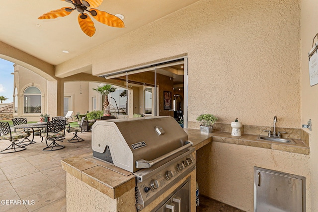 6664 Tuscany Ridge Dr, El Paso, TX 79912 - view of patio with a sink and outdoor dining area