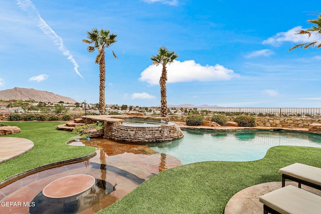 6664 Tuscany Ridge Dr, El Paso, TX 79912 - view of swimming pool with a mountain view, a pool with connected hot tub, and a patio area