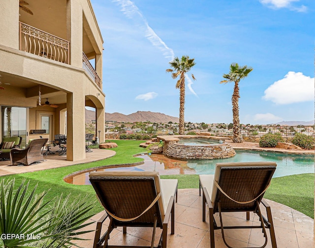 6664 Tuscany Ridge Dr, El Paso, TX 79912 - view of patio featuring a balcony, a mountain view, ceiling fan, a pool with connected hot tub, and outdoor lounge area