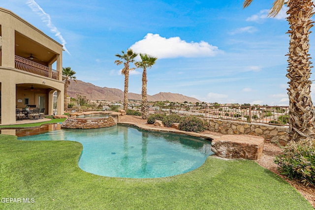 6664 Tuscany Ridge Dr, El Paso, TX 79912 - view of swimming pool with ceiling fan, a mountain view, a patio area, and a pool with connected hot tub