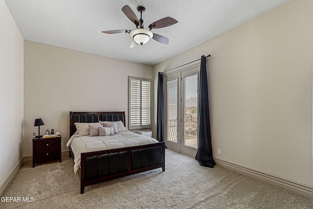 6664 Tuscany Ridge Dr, El Paso, TX 79912 - bedroom featuring access to exterior, light colored carpet, baseboards, and ceiling fan