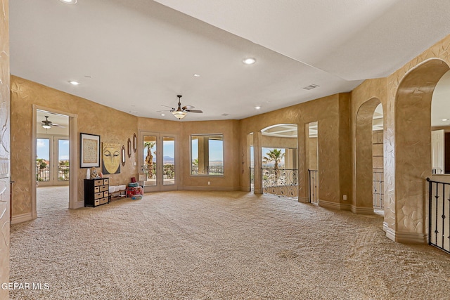 6664 Tuscany Ridge Dr, El Paso, TX 79912 - interior space featuring carpet, a ceiling fan, arched walkways, and recessed lighting