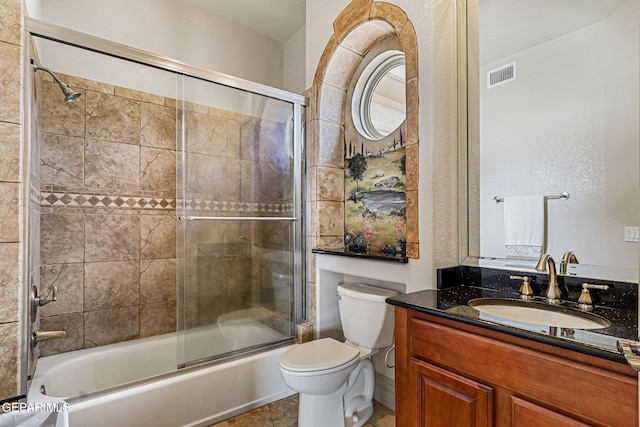 6664 Tuscany Ridge Dr, El Paso, TX 79912 - full bath featuring toilet, shower / bath combination with glass door, and vanity