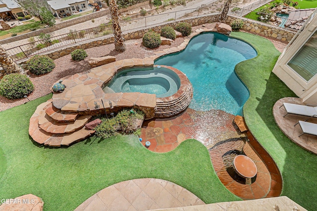 6664 Tuscany Ridge Dr, El Paso, TX 79912 - view of pool with a fenced backyard and a pool with connected hot tub