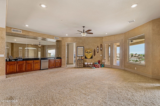 6664 Tuscany Ridge Dr, El Paso, TX 79912 - unfurnished living room with light carpet, ceiling fan, recessed lighting, and baseboards