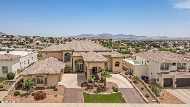 6664 Tuscany Ridge Dr, El Paso, TX 79912 - mediterranean / spanish-style home with stucco siding, concrete driveway, and a tile roof