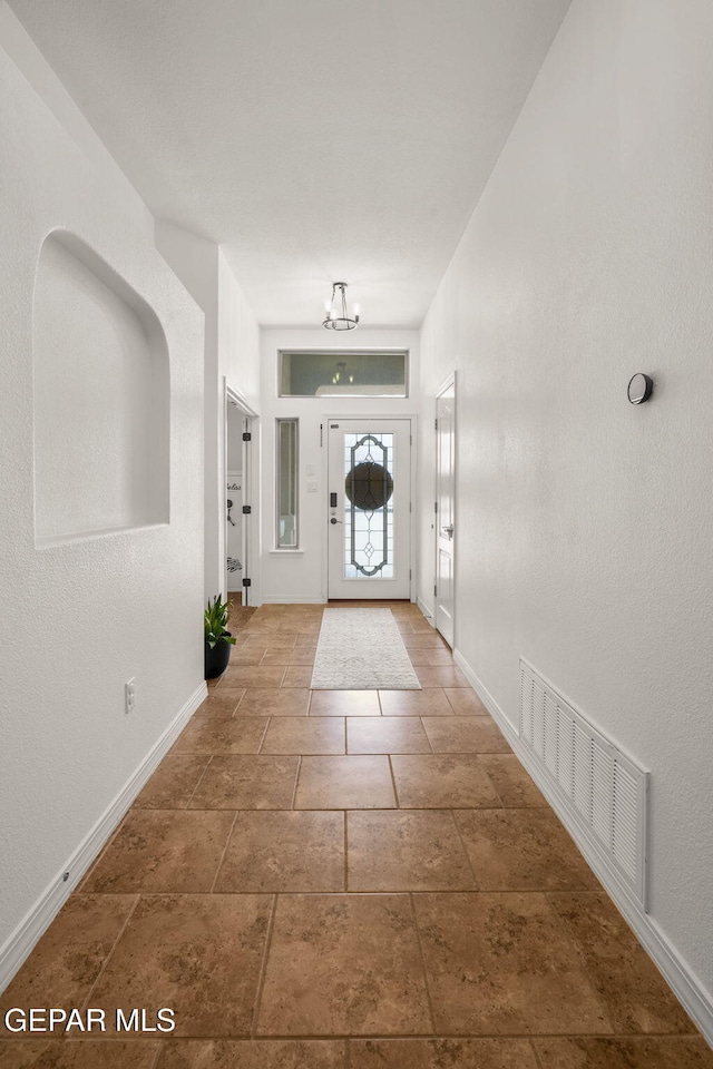 14328 N Cave Dr, El Paso, TX 79938 - foyer with baseboards and a chandelier