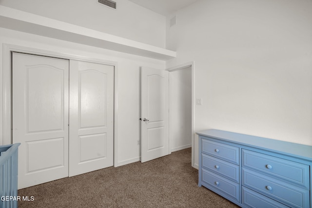 14328 N Cave Dr, El Paso, TX 79938 - unfurnished bedroom with dark carpet and a closet