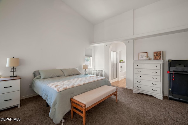 14328 N Cave Dr, El Paso, TX 79938 - carpeted bedroom with high vaulted ceiling, arched walkways, and baseboards