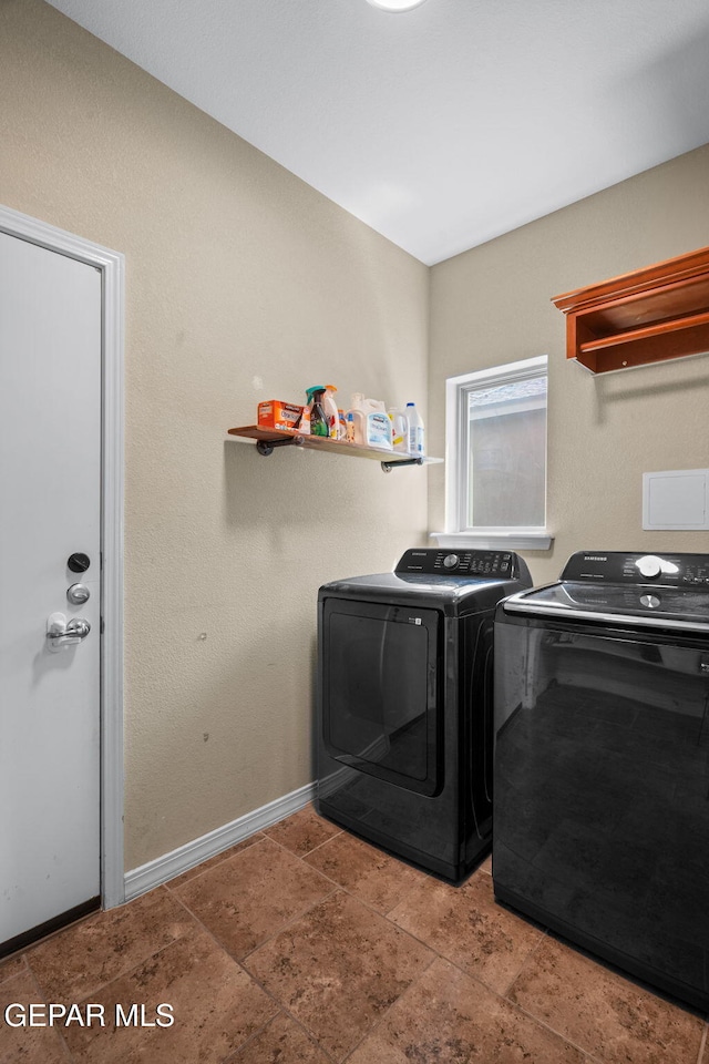 14328 N Cave Dr, El Paso, TX 79938 - washroom featuring washer and clothes dryer, baseboards, and stone finish flooring
