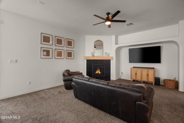 14328 N Cave Dr, El Paso, TX 79938 - carpeted living room featuring a ceiling fan, a fireplace, and baseboards