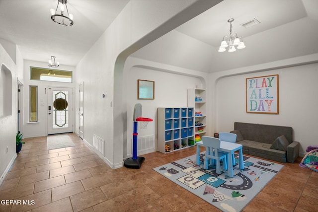 14328 N Cave Dr, El Paso, TX 79938 - entrance foyer featuring a chandelier, arched walkways, baseboards, and a towering ceiling
