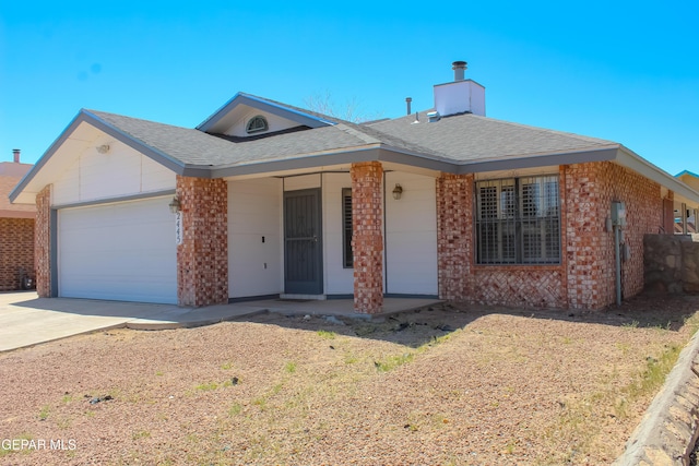 2445 Nancy Mcdonald Dr, El Paso, TX 79936 - ranch-style house with brick siding, an attached garage, driveway, and a chimney