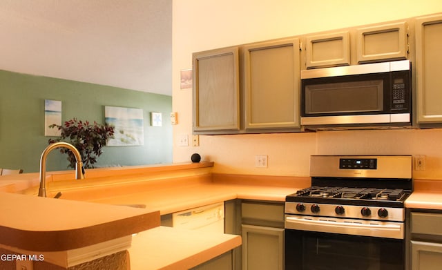 2445 Nancy Mcdonald Dr, El Paso, TX 79936 - kitchen with stainless steel appliances, light countertops, and a peninsula