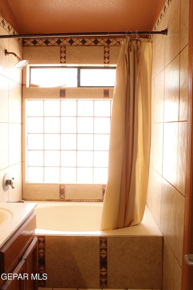 2445 Nancy Mcdonald Dr, El Paso, TX 79936 - full bath with vanity and tiled shower / bath combo