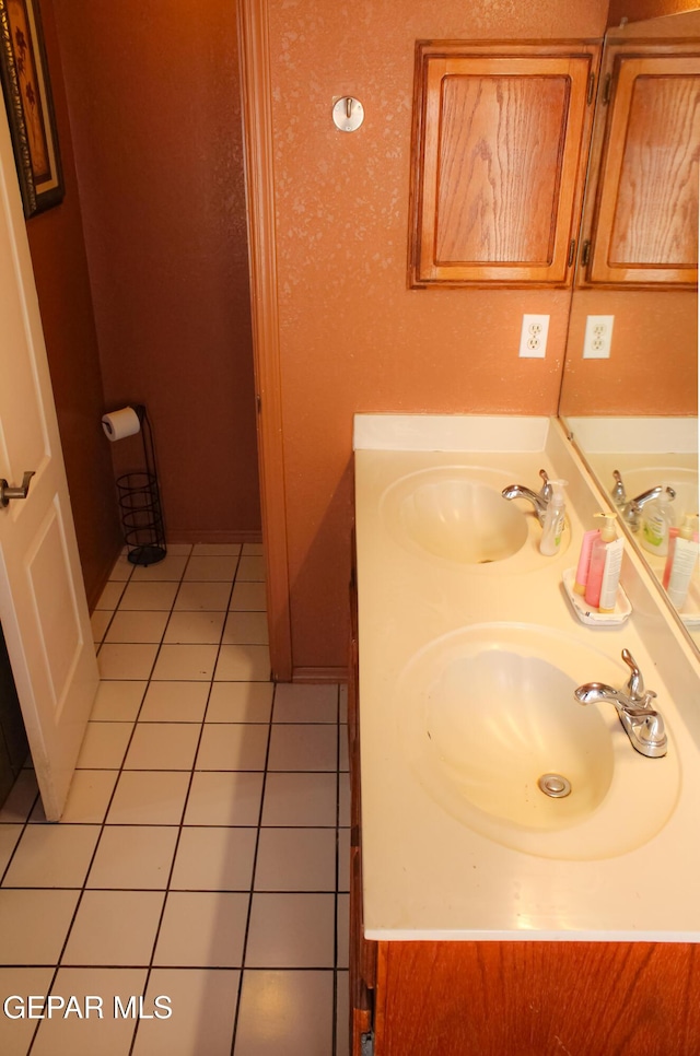 2445 Nancy Mcdonald Dr, El Paso, TX 79936 - bathroom featuring tile patterned flooring and double vanity