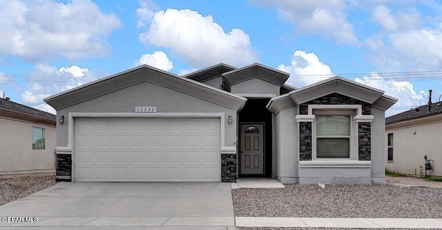 ranch-style house featuring driveway, a garage, stone siding, and stucco siding