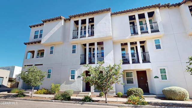 332 Vin Almoradi Ct, El Paso, TX 79912 - mediterranean / spanish house with stucco siding, a balcony, and a tile roof