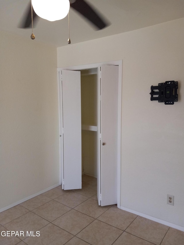 191 Mulberry Ave Unit G, El Paso, TX 79932 - unfurnished bedroom featuring light tile patterned floors, a closet, and a ceiling fan