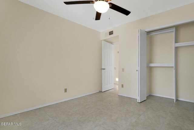 191 Mulberry Ave Unit G, El Paso, TX 79932 - unfurnished bedroom featuring a closet, a ceiling fan, baseboards, and light tile patterned flooring
