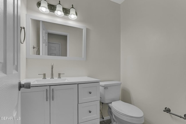 191 Mulberry Ave Unit G, El Paso, TX 79932 - bathroom featuring toilet, vanity, and baseboards