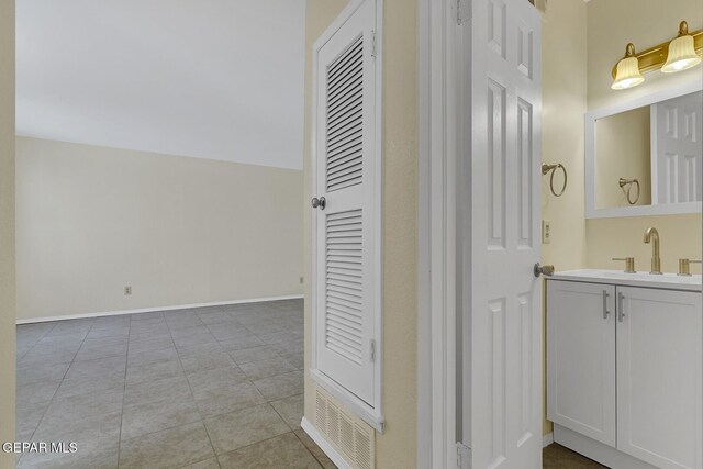 191 Mulberry Ave Unit G, El Paso, TX 79932 - bathroom featuring vanity, tile patterned flooring, and baseboards