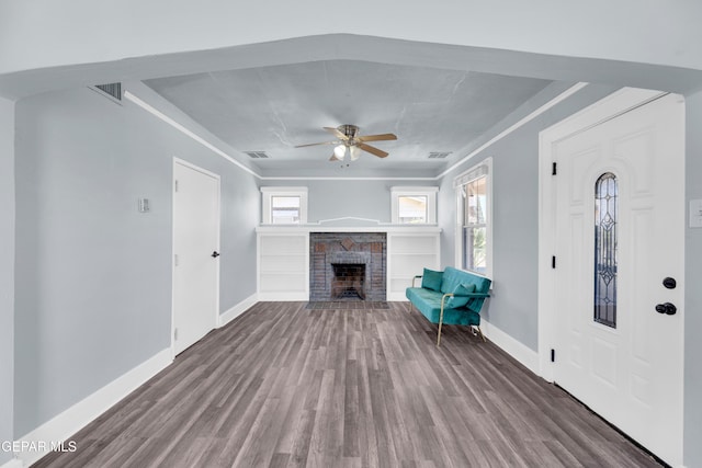 4301 Hueco Ave, El Paso, TX 79903 - unfurnished living room with wood finished floors, baseboards, and a ceiling fan