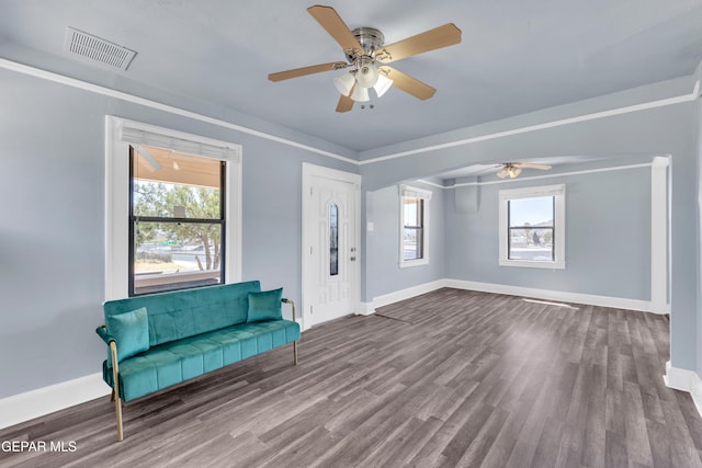 4301 Hueco Ave, El Paso, TX 79903 - unfurnished room with baseboards, a ceiling fan, and dark wood-type flooring
