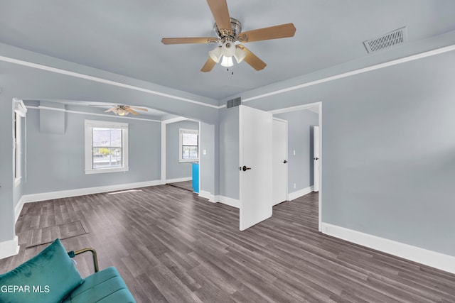4301 Hueco Ave, El Paso, TX 79903 - unfurnished living room featuring a ceiling fan, baseboards, and wood finished floors