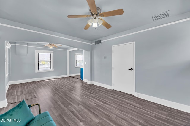 4301 Hueco Ave, El Paso, TX 79903 - unfurnished living room featuring a ceiling fan, baseboards, and wood finished floors