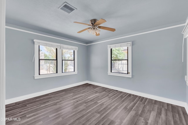4301 Hueco Ave, El Paso, TX 79903 - unfurnished room with dark wood-type flooring, baseboards, a ceiling fan, and ornamental molding