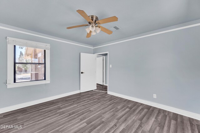 4301 Hueco Ave, El Paso, TX 79903 - empty room featuring wood finished floors, baseboards, ceiling fan, and crown molding