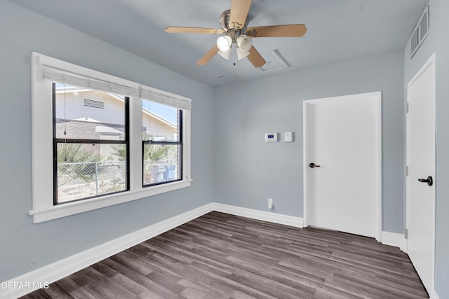 4301 Hueco Ave, El Paso, TX 79903 - empty room featuring dark wood-type flooring, baseboards, and a ceiling fan