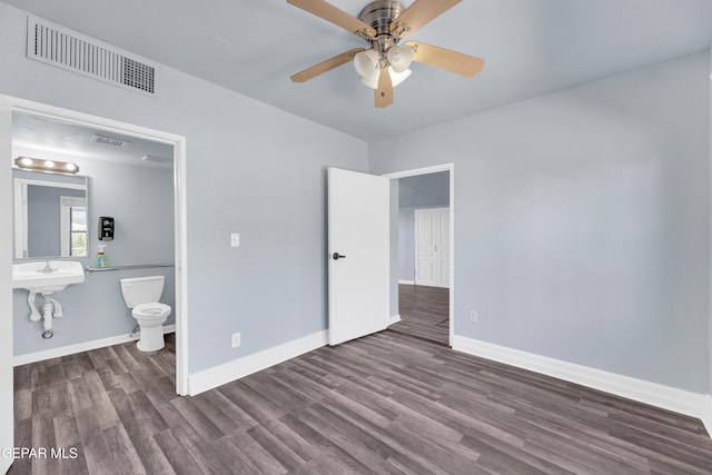 4301 Hueco Ave, El Paso, TX 79903 - unfurnished bedroom with wood finished floors, baseboards, and a ceiling fan