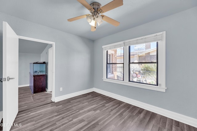 4301 Hueco Ave, El Paso, TX 79903 - unfurnished room with wood finished floors, baseboards, and ceiling fan